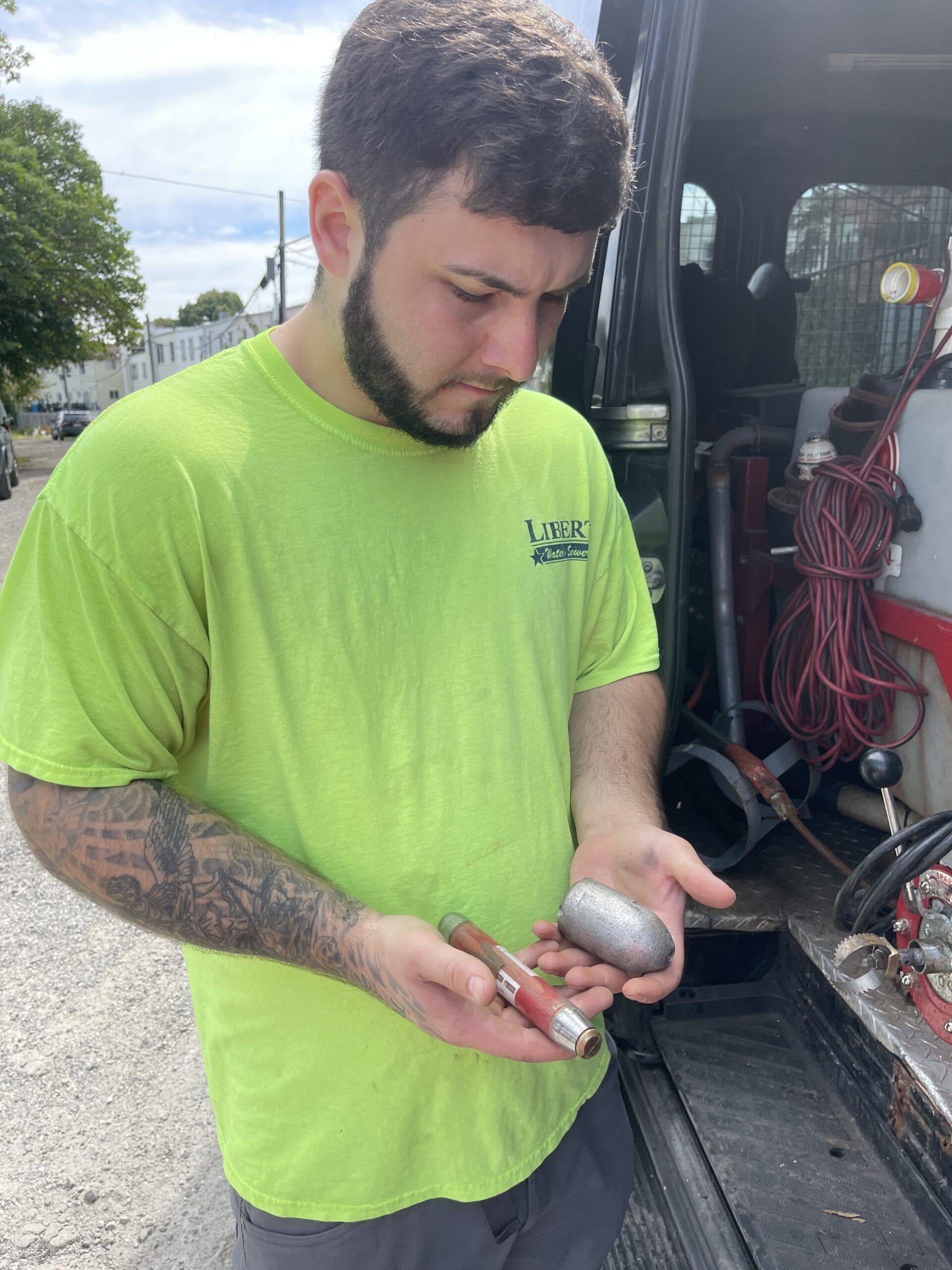 Man holding a metal equipment