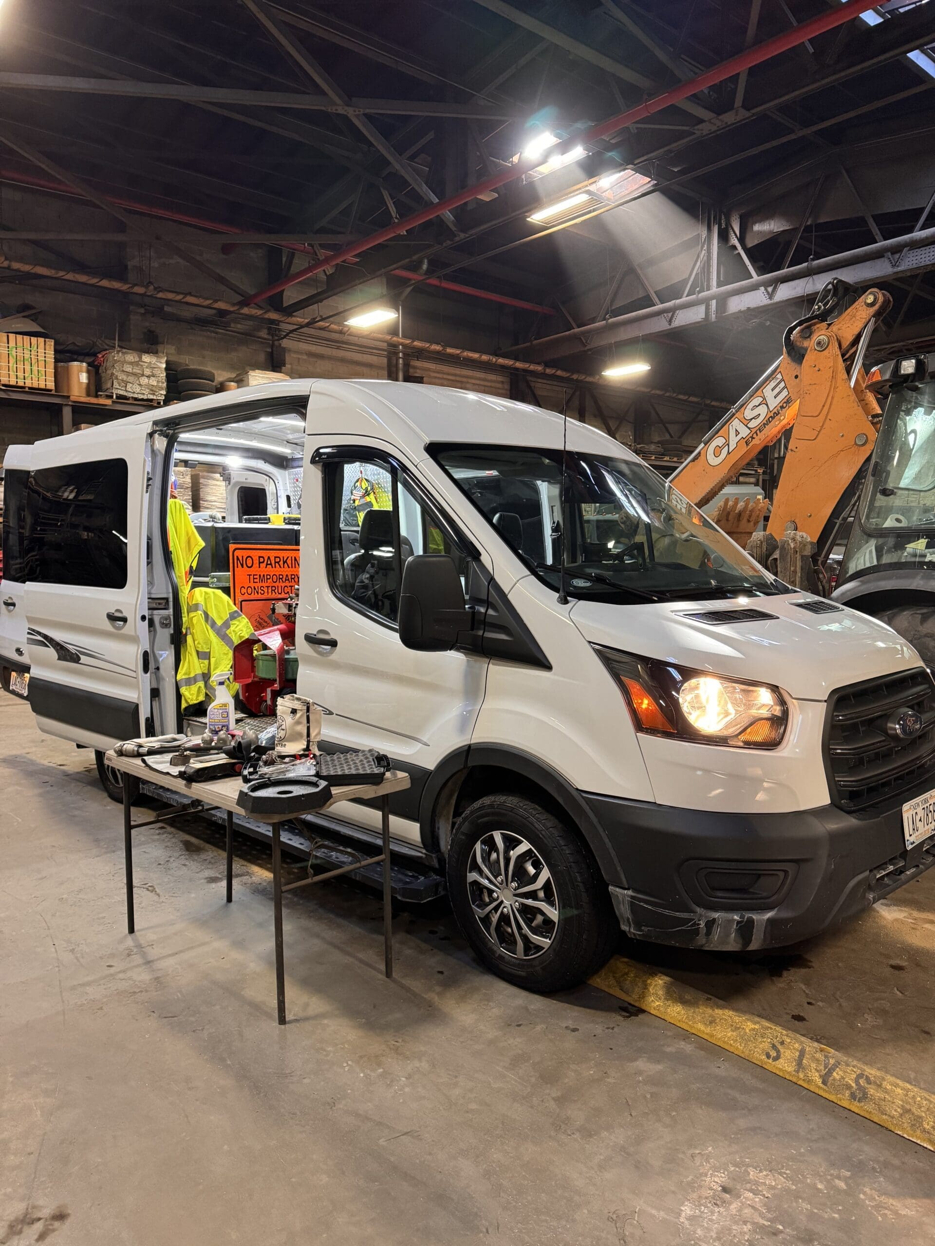 Van with sewer and drain equipment inside